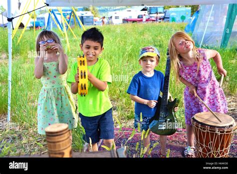 Children Playing Musical Instruments Outside Stock Photo Alamy