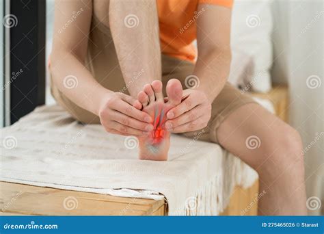 Varus Valgus And Hallux Valgus Or Bunion On Middle Aged Woman Foot Isolated Closeup On Dark