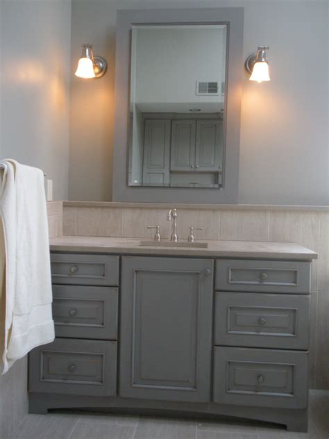 Custom Made Vanities In A Distressed Grey Finish Give This Bathroom