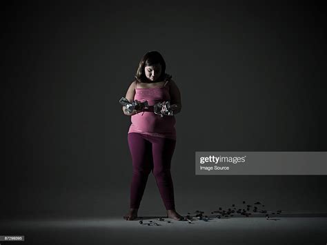 Girl With Candy Wrappers Photo Getty Images
