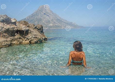 Girl In The Sea With Clear Transparent Azure Water Beautiful Back