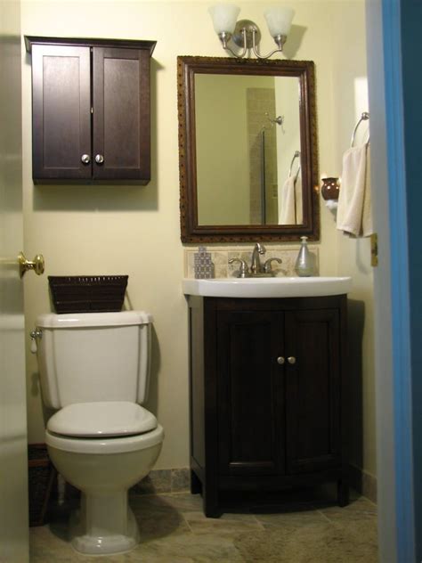 As the small bathroom above shows, adding a mirror across a whole wall can double the look and feel of the room. Bathroom. small dark brown wooden cabinet with double ...