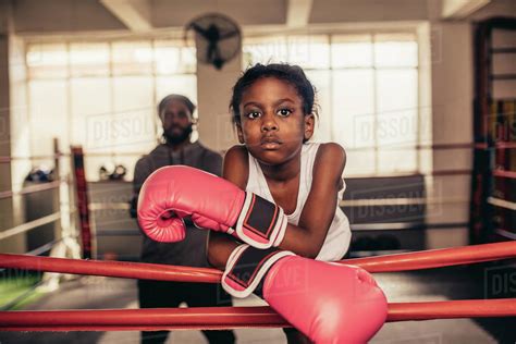 Confident Looking Boxing Kid Standing Inside A Boxing Ring