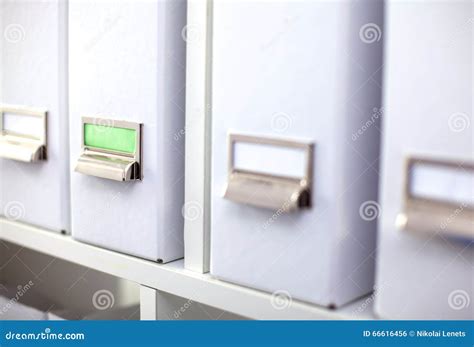 File Folders Standing On Shelves In The Background Stock Photo Image