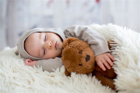 Sweet Baby Boy Sleeping With Teddy Bear 4k Ultra Hd Wallpaper