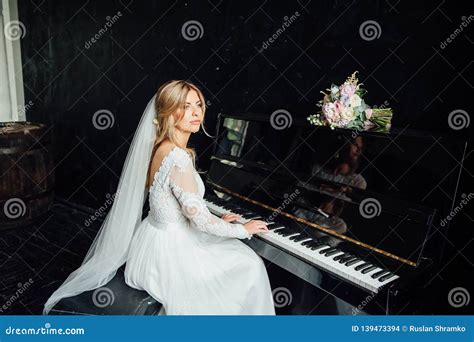 Incredibly Beautiful Bride Plays The Piano Wedding Day Stock Photo
