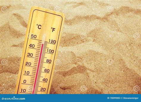 Extremely High Temperatures Thermometer On Warm Desert Sand Stock