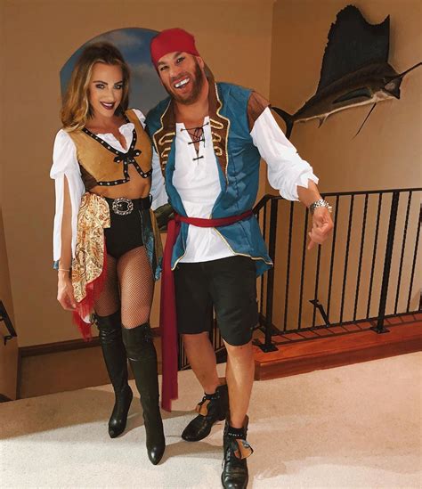 a man and woman dressed in pirate costumes
