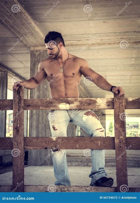 Muscular Construction Worker Shirtless In Building Site Stock