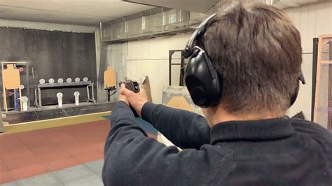 Young Man Aims Holding Gun At Shooting Stock Footage Sbv 329891181