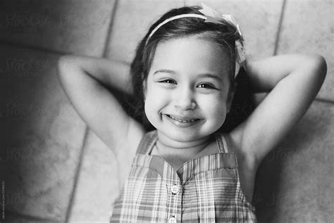 Black And White Portrait Of A Beautiful Young Girl Smiling By Stocksy