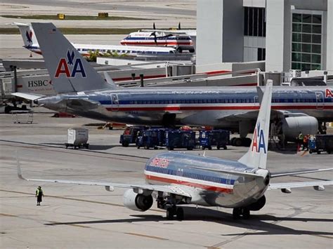 Amr Unions Plan To Back Takeover Bid By Us Airways Cbs News