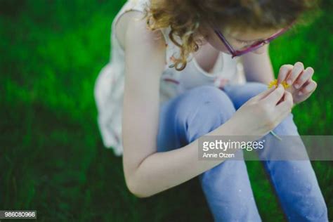 Tween Buds Tween Girl With Braids Poses In Tall Grass Stock Photo