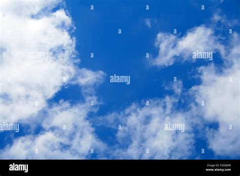 Puffy Clouds On Blue Sky Stock Photo Alamy