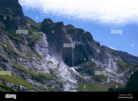 Scenic Waterfall On Alpine Peak Rocky Alps With Beautiful Scenery