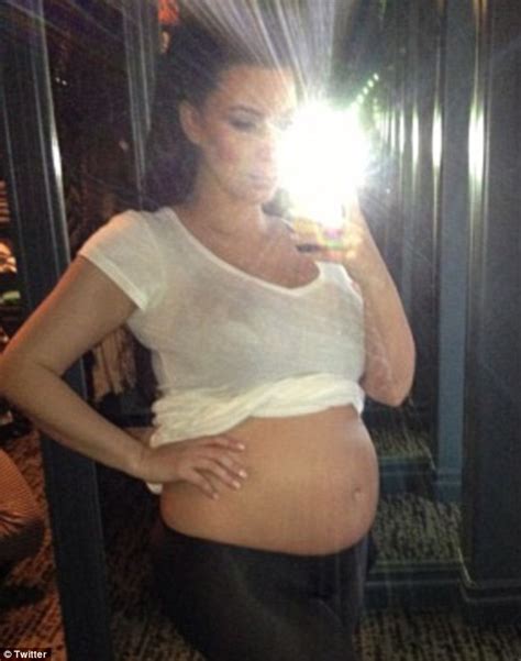Kim Kardashian Pregnant Star Shows Off Her Baby Bump On