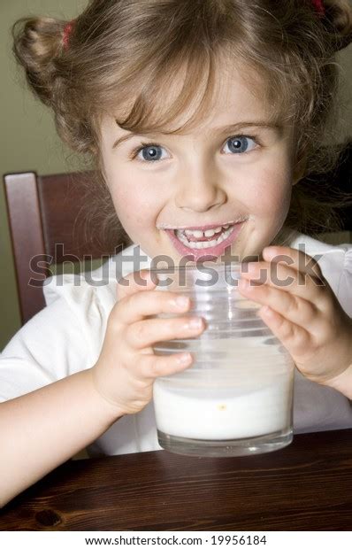 Little Girl Drinking Milk Stock Photo 19956184 Shutterstock