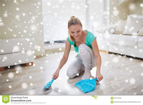 Happy Woman With Brush And Dustpan Sweeping Floor Stock Photo Image