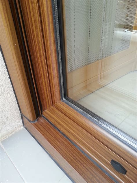 Cambiar las ventanas por completo. Ventana de aluminio lacado madera nogal b-7 | Carpintería ...