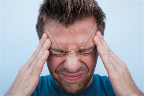 Portrait Of Caucasian Man Having A Headache Close Up Stock Photo Image Of Caucasian Dramatic