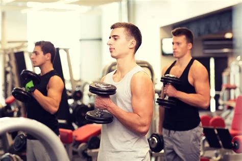 Group Of Men With Dumbbells In Gym Stock Image Everypixel