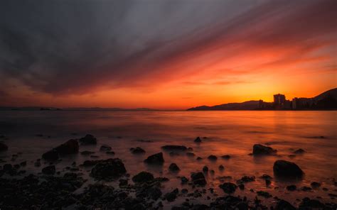 Download Wallpaper 3840x2400 Sea Sunset Stones Horizon Sky Coast