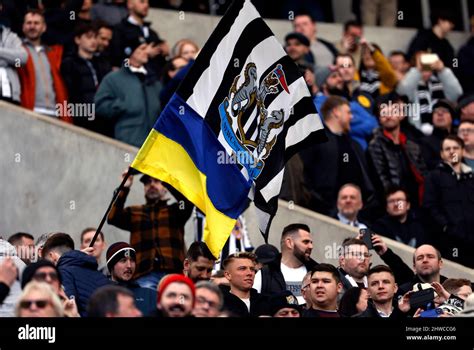 Newcastle United Fans In The Stands With Flags And The Colours Of