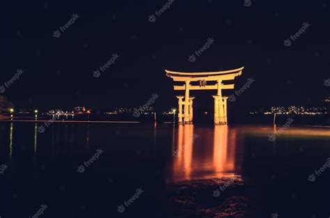 Free Photo Illuminated Itsukushima Floating Torii Gate At Night