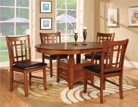 Perfect for weeknight meals and holiday feasts, this charming dining table showcases a neutral finish, drop leaf design, and 2 lower shelves. The beauty of Round Dining Room Table with Leaf / Leaves ...