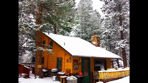 Located on 2.2 acres of private land, guests enjoy luxurious details such as vaulted ceilings, a stone shower with a waterfall, fireplace, and an outdoor patio. Daniel Boone Cabin | Estes Park, CO