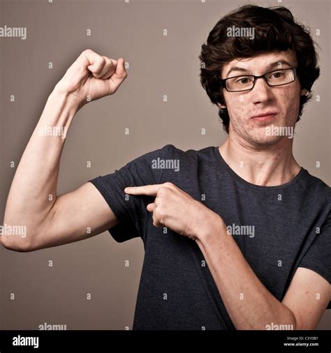 A Weak Feeble Geek Nerd Young Man With Thin Arms Wearing Glasses Stock