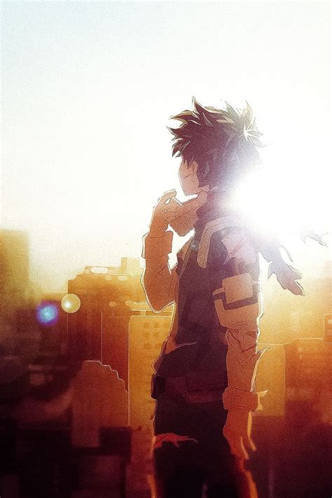 A Man Standing In Front Of A City Skyline With The Sun Shining Through
