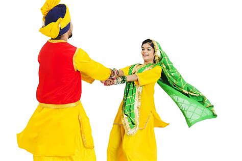 Sikh Punjabi Couple In Traditional Clothing Playing Kikli Game On