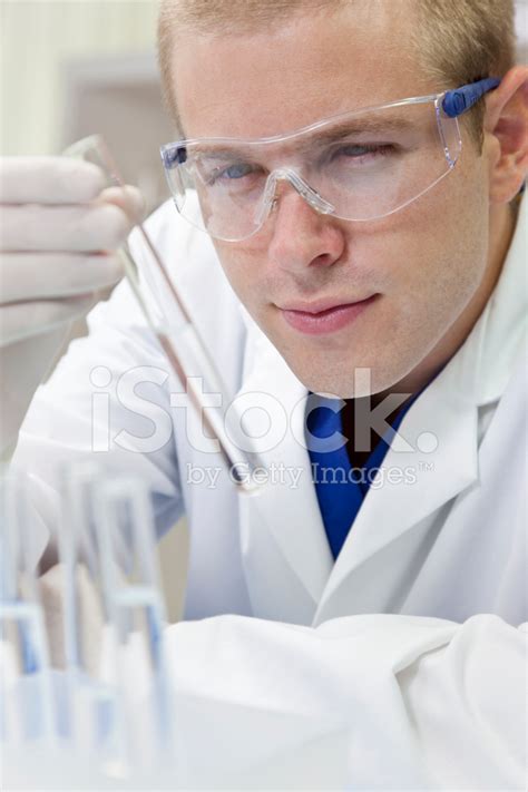 Male Scientist Or Doctor With Test Tube In Laboratory Stock Photo
