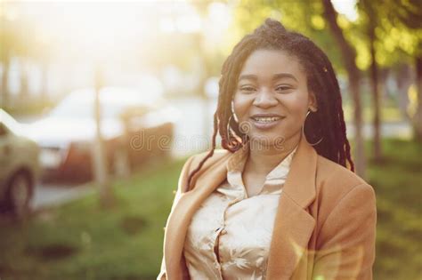 Portrait Of A Young Black Woman Standing In A Street Stock Photo