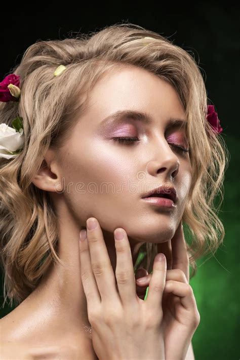 Beautiful Young Blonde Girl With Naked Shoulders Flowers Braided Into