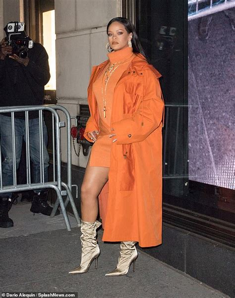 Rihanna Puts On Head Turning Display In Vibrant Orange Mini Dress At