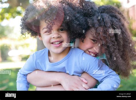 Portrait Of Two Sisters Hugging Smiling Stock Photo Alamy