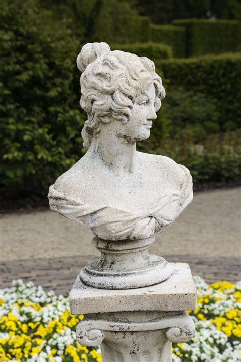 medieval sensual woman sculpture in the gardens of castle of arcen netherlands stock image