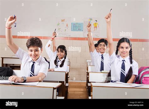 Indian Group School Kids Students Studying Hand Raised In Class