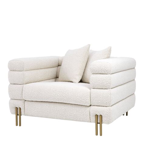 Create an inviting atmosphere with new living room chairs. York Boucle Cream Armchair | SHOP NOW