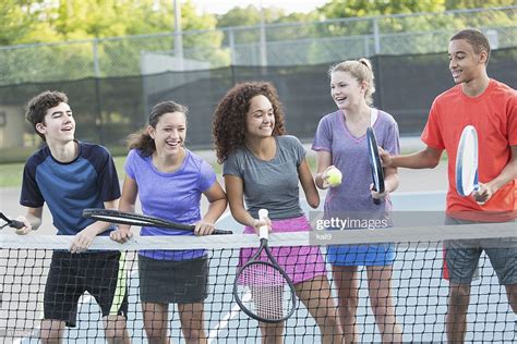 Teenagers Playing Tennis High Res Stock Photo Getty Images
