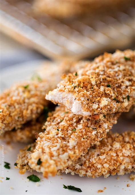 Bake the chicken tenders for approximately 15 to 20 minutes, or until each tender is fully cooked and a thermometer inserted into the thickest part reads 165 degrees fahrenheit. Crunchy Baked Chicken Tenders - The Chunky Chef