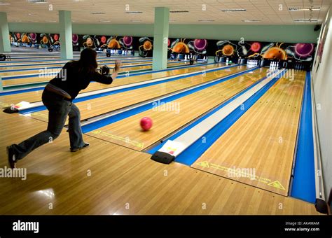 A Female Bowler Makes Her Shot At A Ten Pin Bowling Alley Birmingham