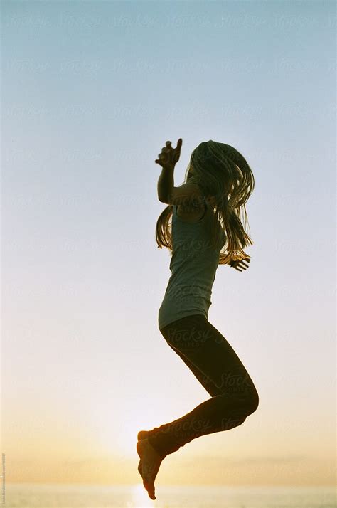 Girl Jumping In The Air By Stocksy Contributor Amor Burakova Stocksy