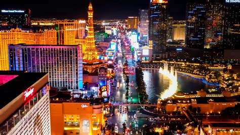Flying Over Downtown Las Vegas At Night With A View Of Hotels Along The
