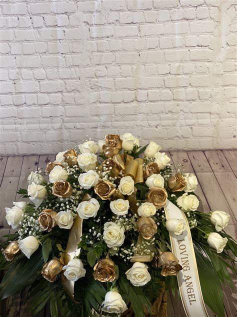 White And Gold Rose Casket Spray By Leos Metropolitan Florist