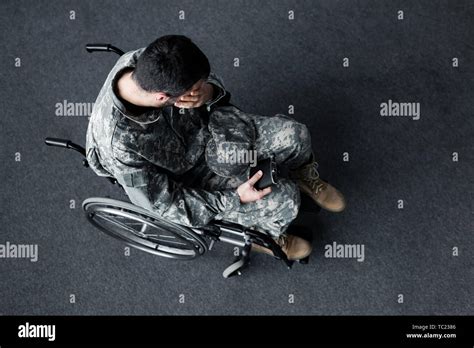 Overhead View Of Disabled Man In Military Uniform Sitting In Wheelchair