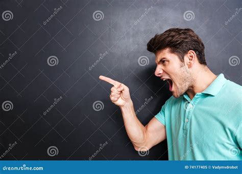 Side View Of A Angry Man Screaming Over Black Background Stock Image