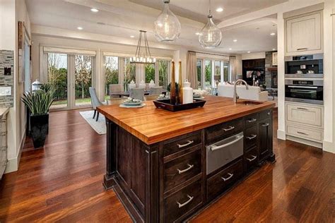 This kitchen island features a towel rack, spice rack, one spacious drawer and enclosed cabinet space with one shelf. 27 Kitchens with French Doors | Wood countertops kitchen ...